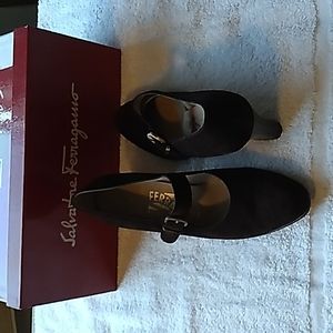 Brown suade ferrigamo strap pumps.